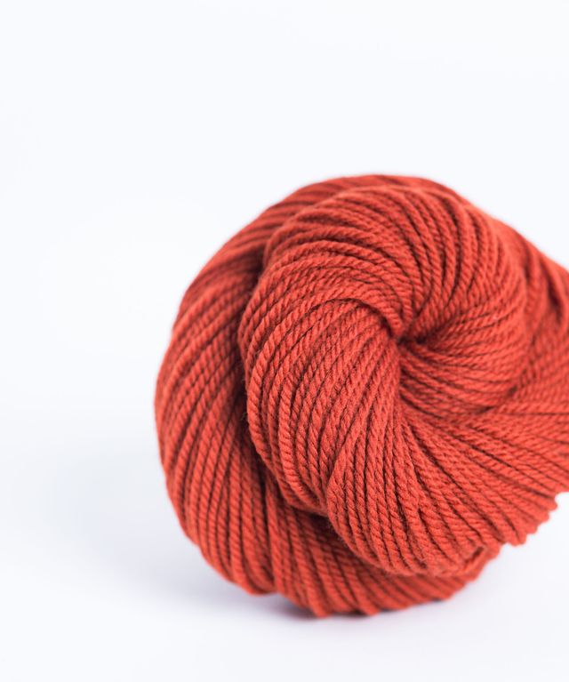 Skein of dark brick red orange Brooklyn Tweed Arbor yarn in color Butte - Hillsborough Yarn Shop - Hillsborough, NC, USA