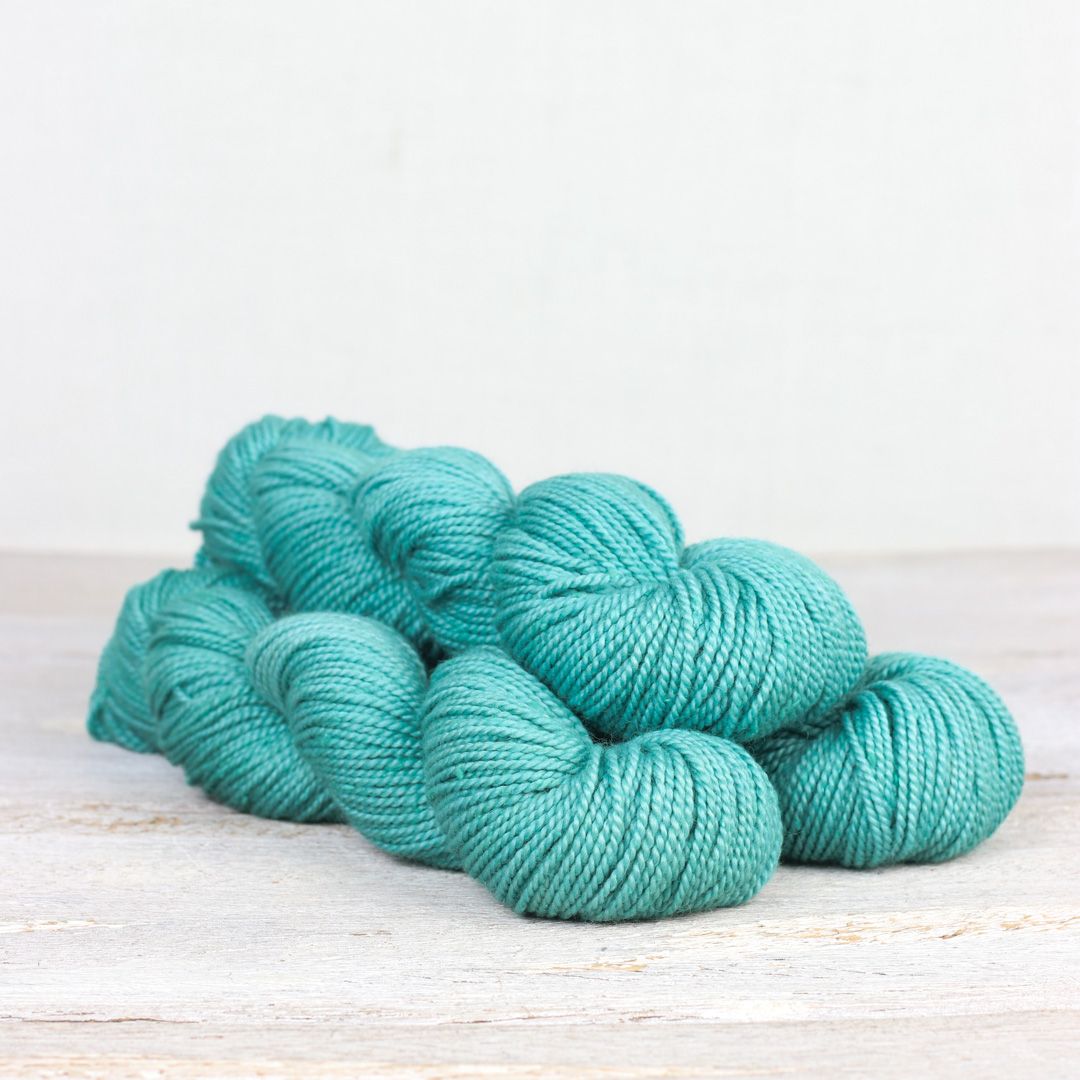 3 skeins of aqua Fibre Co. Acadia yarn. 