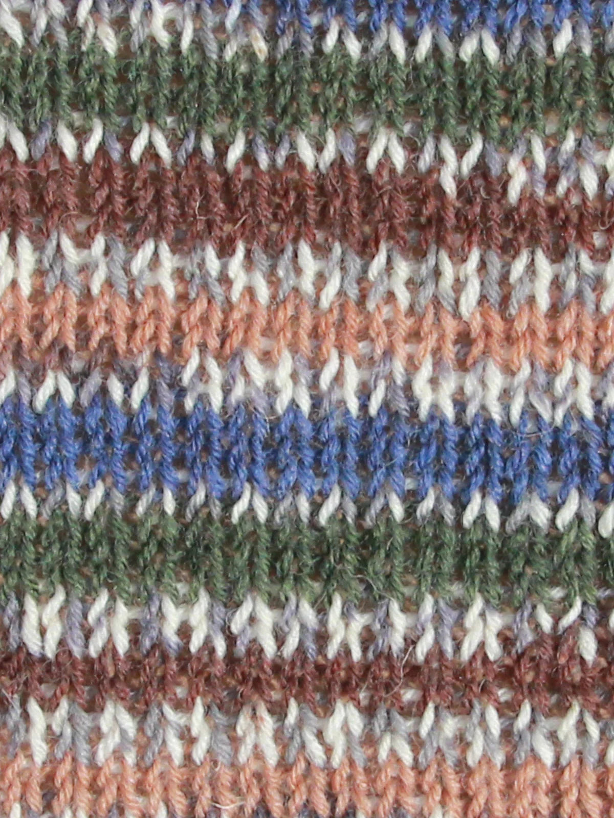 Close-up of Mallard swatch - multicolored striped fabric with brown, blue, green, and white patterns.