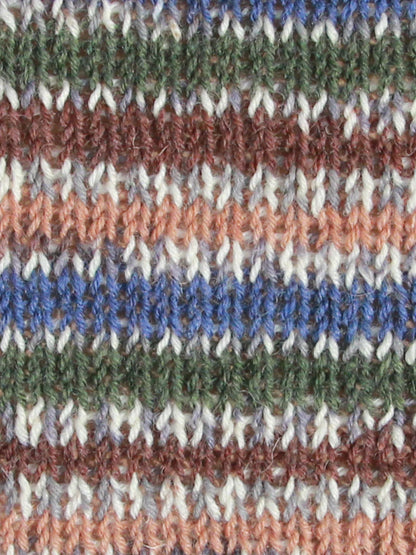 Close-up of Mallard swatch - multicolored striped fabric with brown, blue, green, and white patterns.