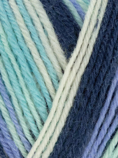 Close-up of multicolored yarn with shades of blue, teal, and beige.