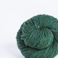 Bottle green ball of Brooklyn Tweed Loft yarn. 